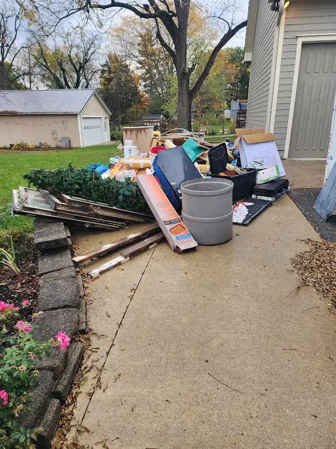 Dumpster being loaded with debris for 10 Yard Dumpster Rental in Pekin